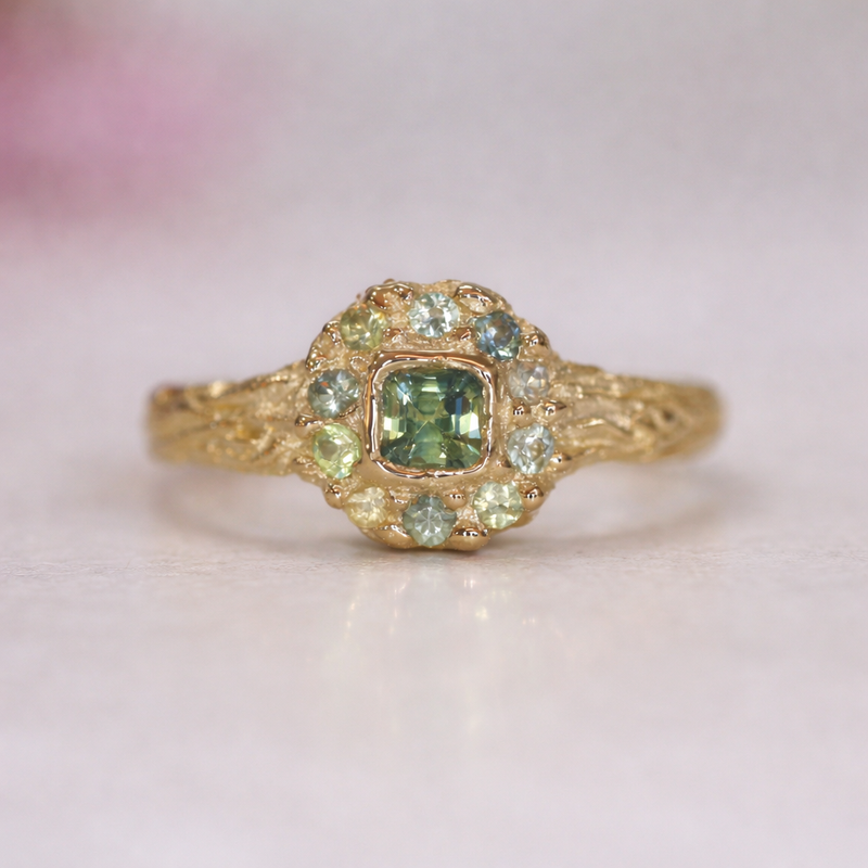 Custom gold ring green sapphire custom design by Albuquerque jeweler Alexis Pavlantos.